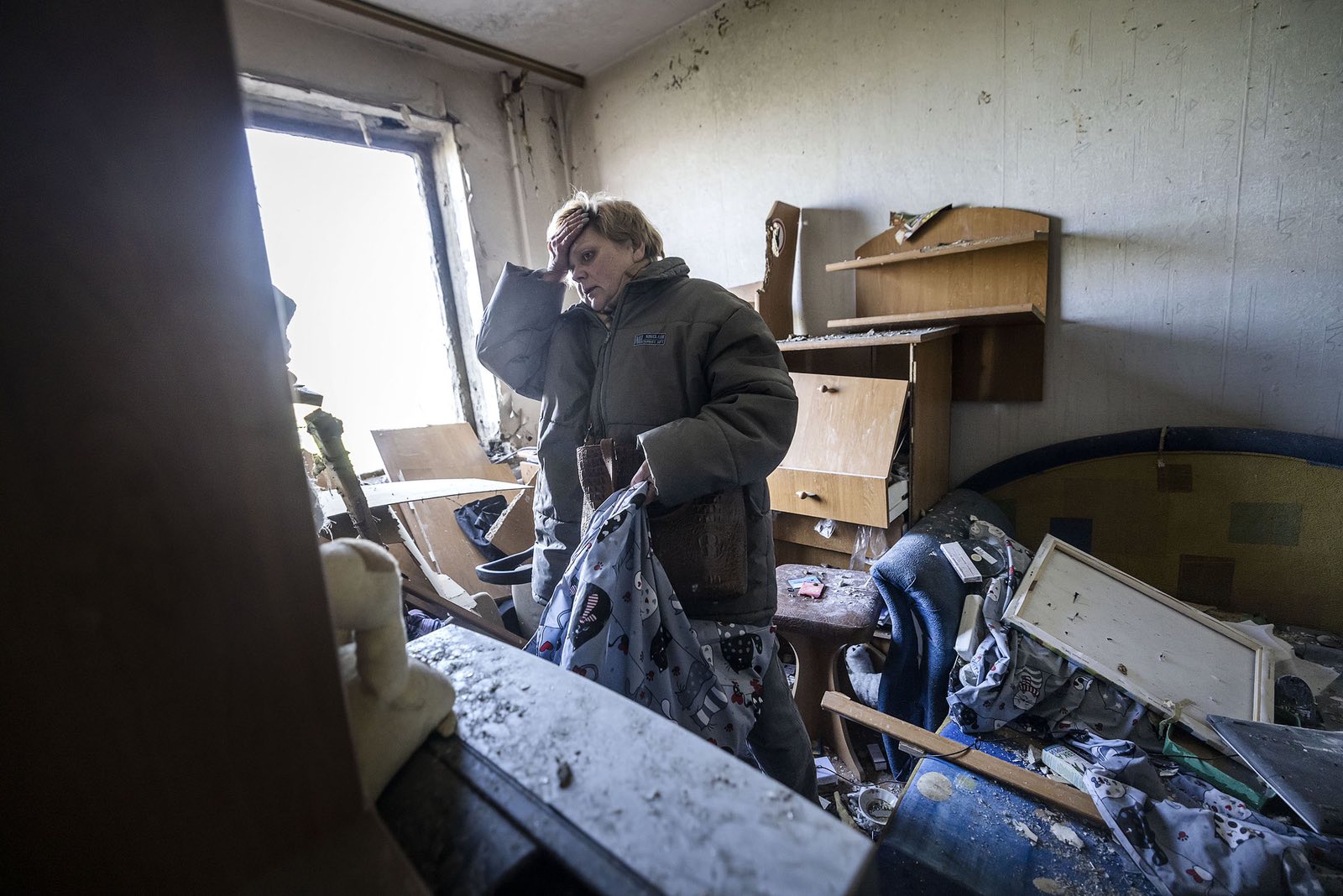 I was crawling under this rubble and shouting to my mother, “Are you alive?!