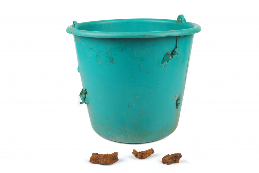 Artifact "Bucket damaged by debris"